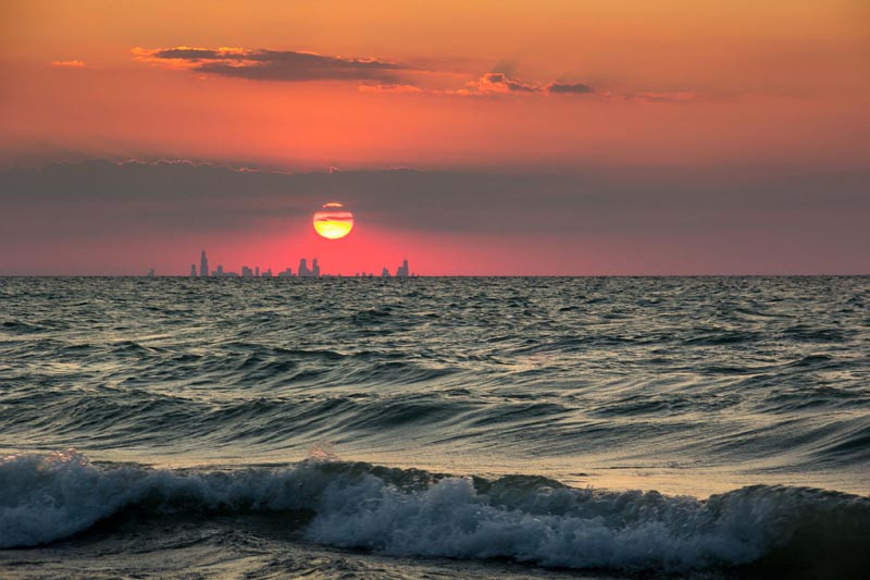 chicago-skyline-from-indiana-sunset-across-water