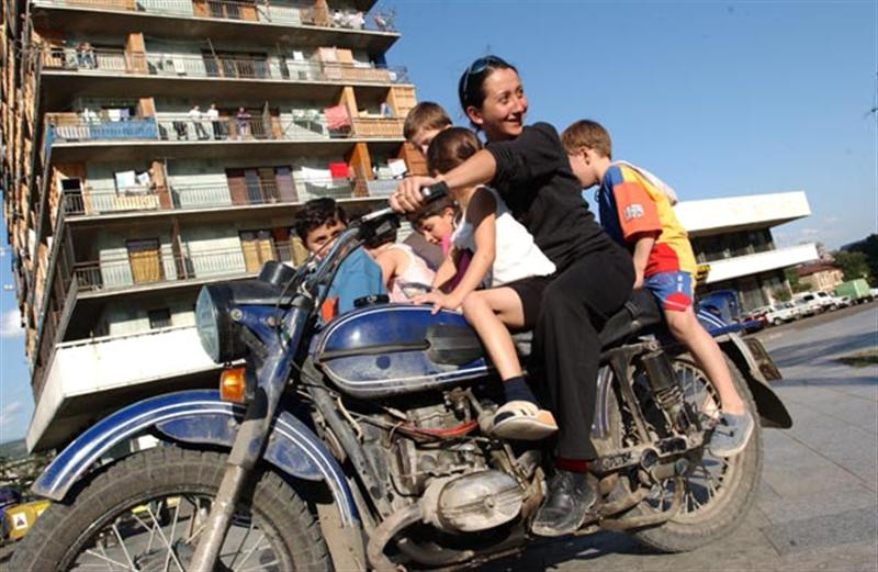 Melina Drives Refugee Kids Around Hotel Iveria in Tbilisi (Mediu