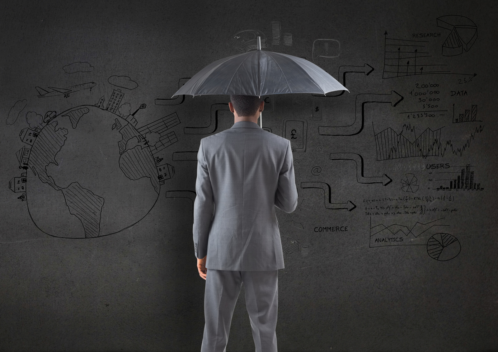 Businessman holding an umbrella against business plan sketch on
