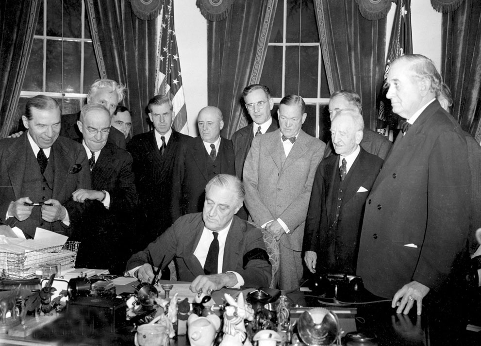 President Roosevelt signs the declaration of war following the J