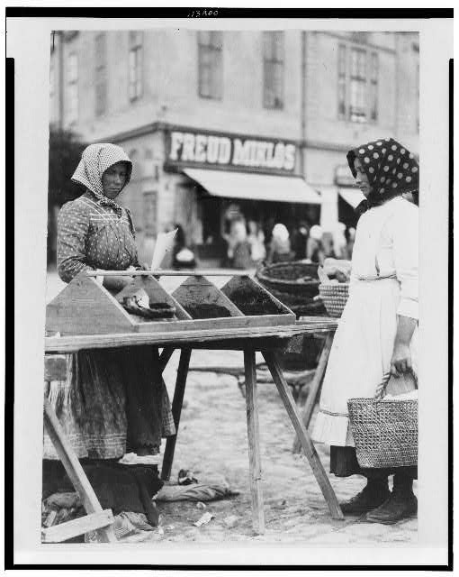 Woman selling food in market, Hungary 1920