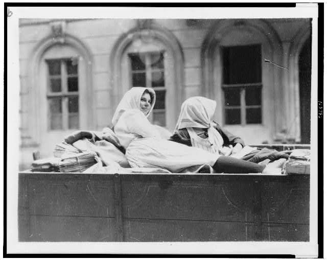 Two women in back of wagon, Hungary