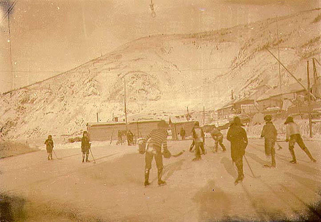 Boys playing ice hockey, Dawson, Yukon Territory