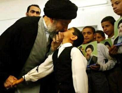 Iran Mullah kisses boy