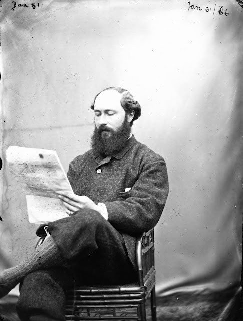 Ambrose Congreve reading a newspaper at Clonbrock House