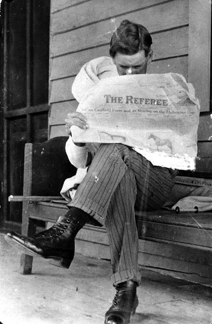 Overseer Jim Riley reading a newspaper on Isis Downs Station, 19