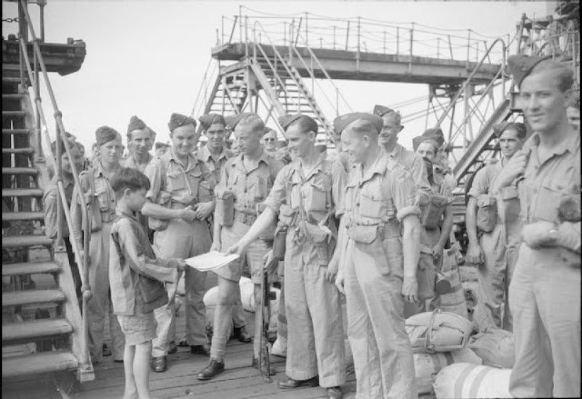 Royal Air Force personnel newly arrived in Hong Kong show a loca