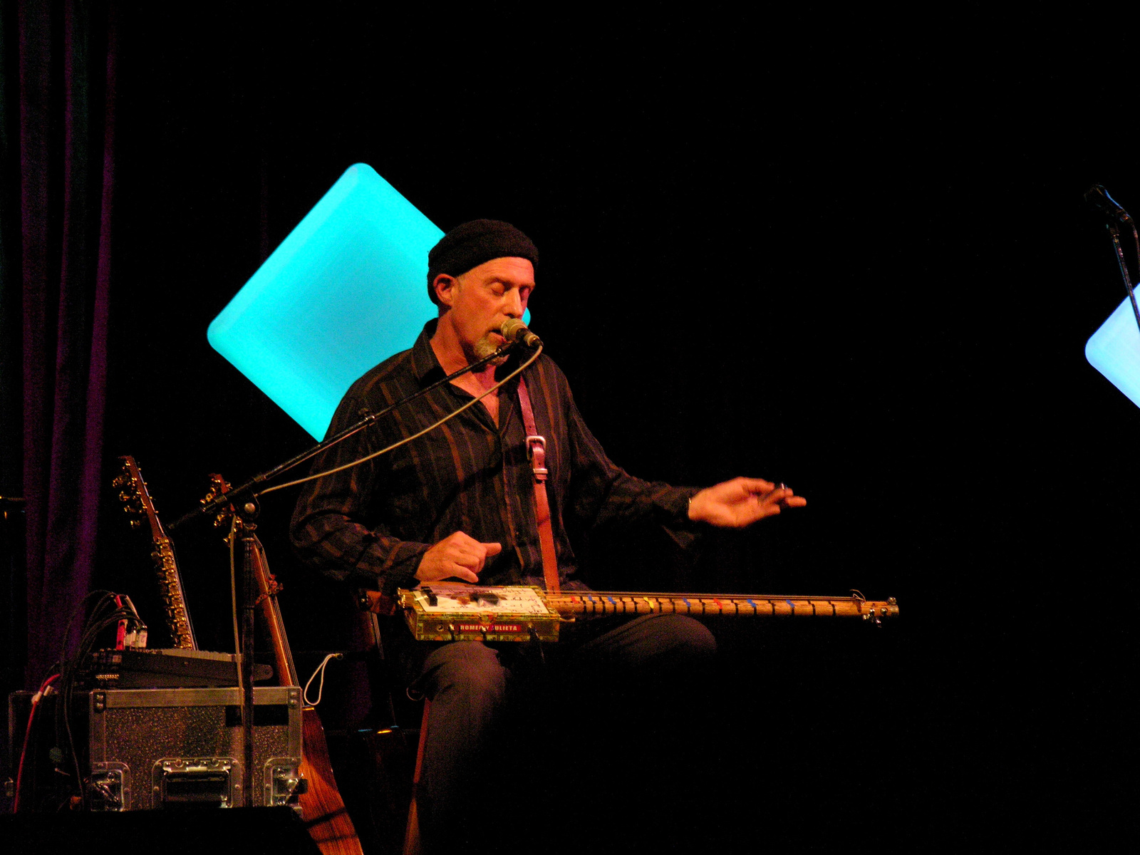 Harry manx playing his cigar box guitar