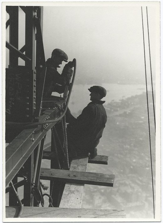 Two-workers-riveting-a-corner-beam-1931-520x714